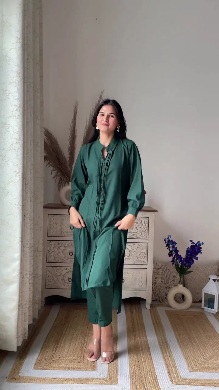 Women’s Ethnic Wear Set Featuring Red Kurti with White Embroidered Detailing and Keyhole Neck Paired with White Lace Pants, and Classic Green Solid Kurti with Matching Straight Pants for Festive