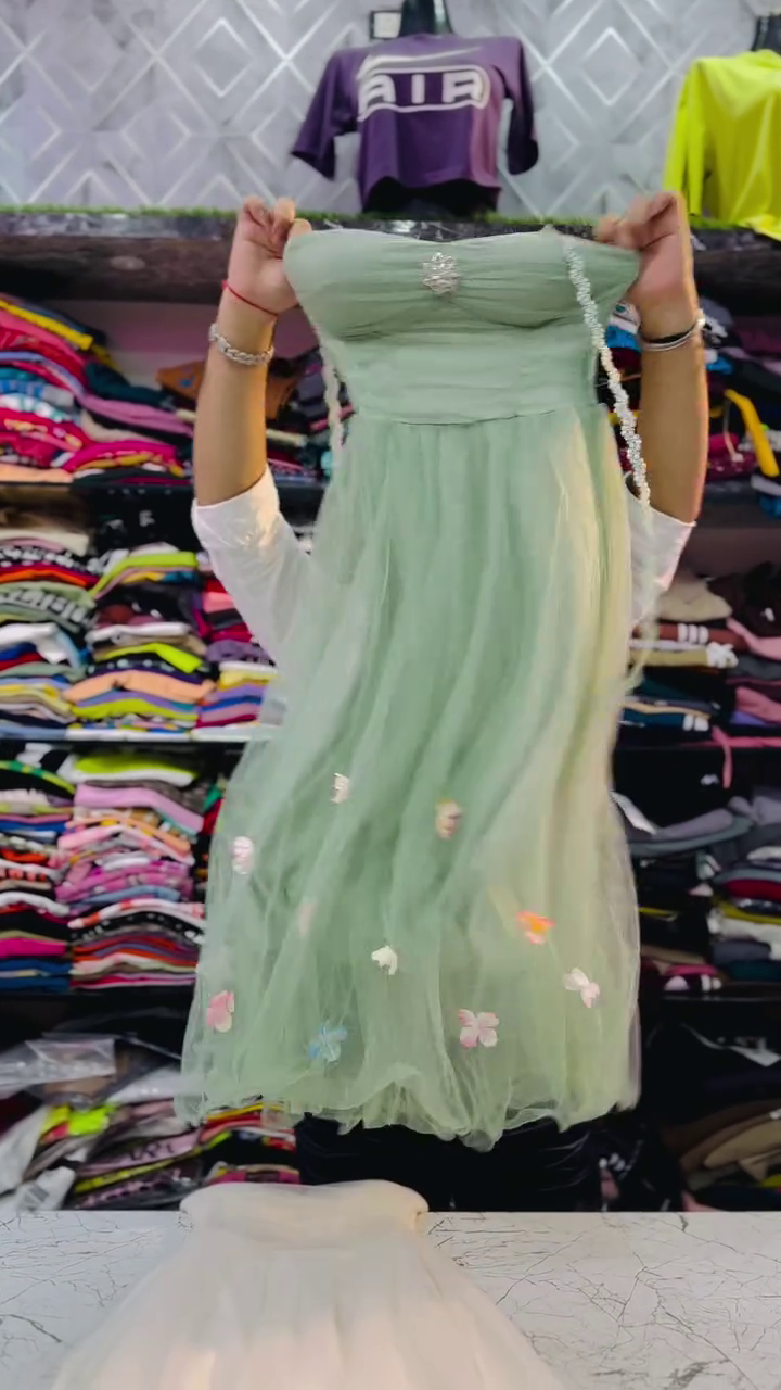 Elegant Girls’ Party Wear Dress Combo – Off-Shoulder White and Mint Green Gowns with Sheer Floral Overlay, Embellished Brooch Detail and Flowing Tulle Skirt