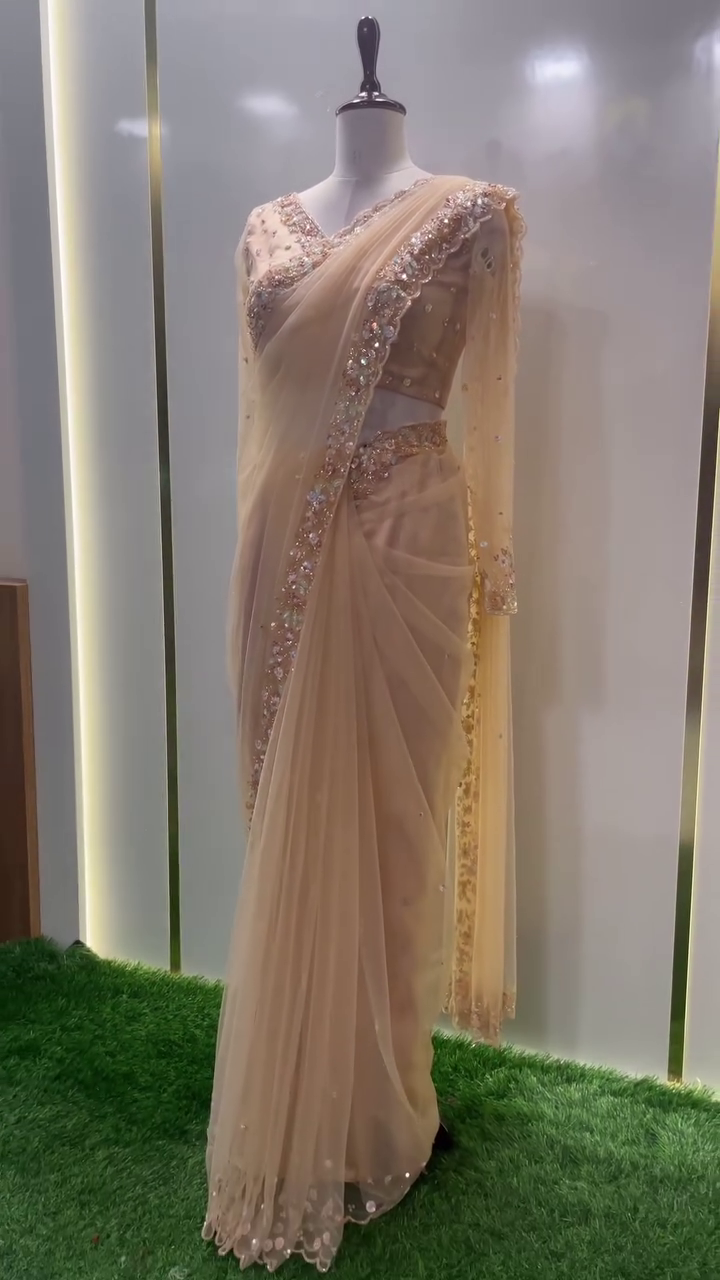 Peach Net Saree with Intricately Embellished Sequin and Pearl Border, Matching Handcrafted Blouse, and Delicate Stone Work – Ideal for Reception, Cocktail Party, or Grand Celebrations