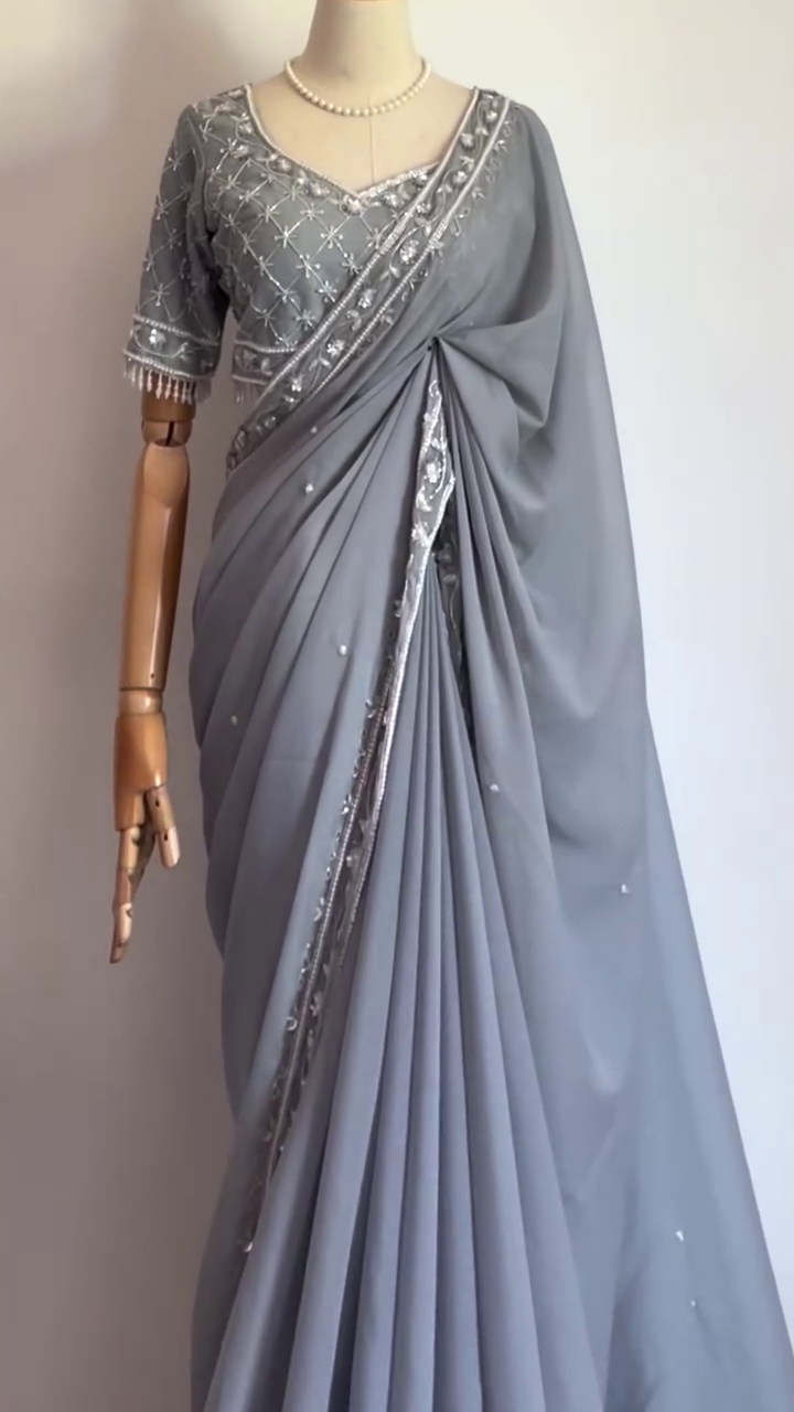 Grey Georgette Saree with Intricate Silver Embroidery, Mirror Work Border, and Matching Heavily Embellished Blouse – Perfect for Festive Occasions, Evening Parties, and Elegant Celebrations