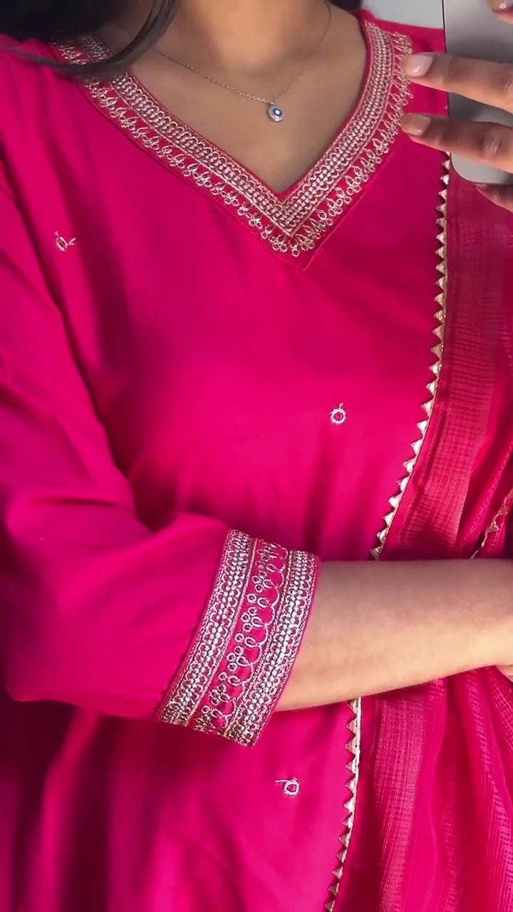 Vibrant Fuchsia Pink Salwar Kameez Set with Intricate Embellishments, Featuring a Stylish V-neckline, Matching Dupatta with Elegant Border