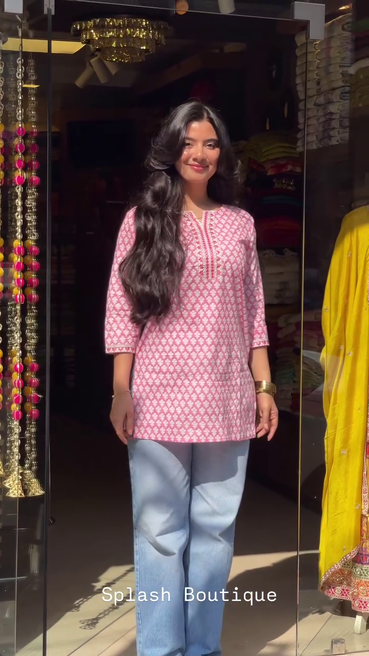 Stylish Printed Short Kurti Collection Featuring Delicate Embroidery on Neckline and Sleeves – Available in Pastel Pink, Sage Green, and Soft Red Shades – Perfect for Casual Outings, Workwear, and Everyday Comfort with Jeans or Trousers