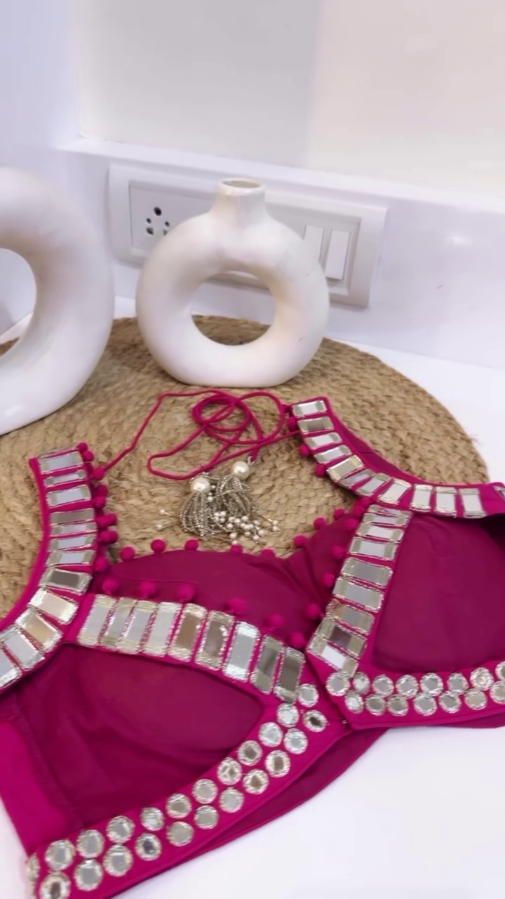 Rani Pink Mirror Work Lehenga Choli Set Featuring a Sleeveless Embellished Blouse with Tie-Up Back, Paired with a Flared Embroidered Lehenga and Soft Tie-Dye Dupatta with Mirror Border – Ideal for Mehendi, Haldi, or Festive Celebrations