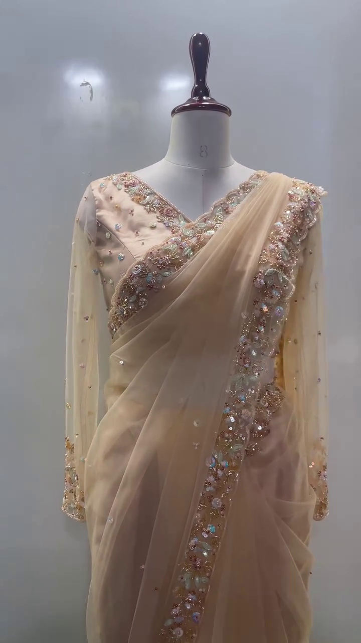 Peach Net Saree with Intricately Embellished Sequin and Pearl Border, Matching Handcrafted Blouse, and Delicate Stone Work – Ideal for Reception, Cocktail Party, or Grand Celebrations