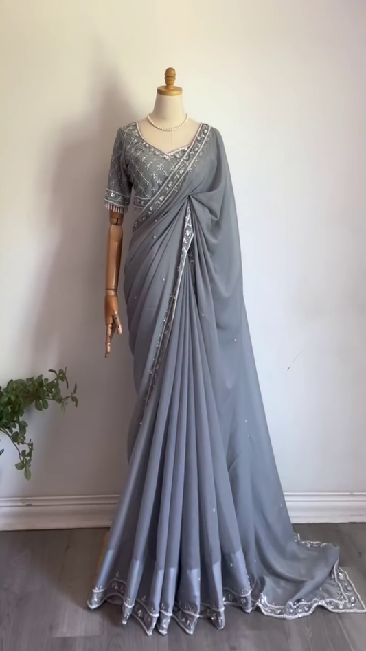 Grey Georgette Saree with Intricate Silver Embroidery, Mirror Work Border, and Matching Heavily Embellished Blouse – Perfect for Festive Occasions, Evening Parties, and Elegant Celebrations