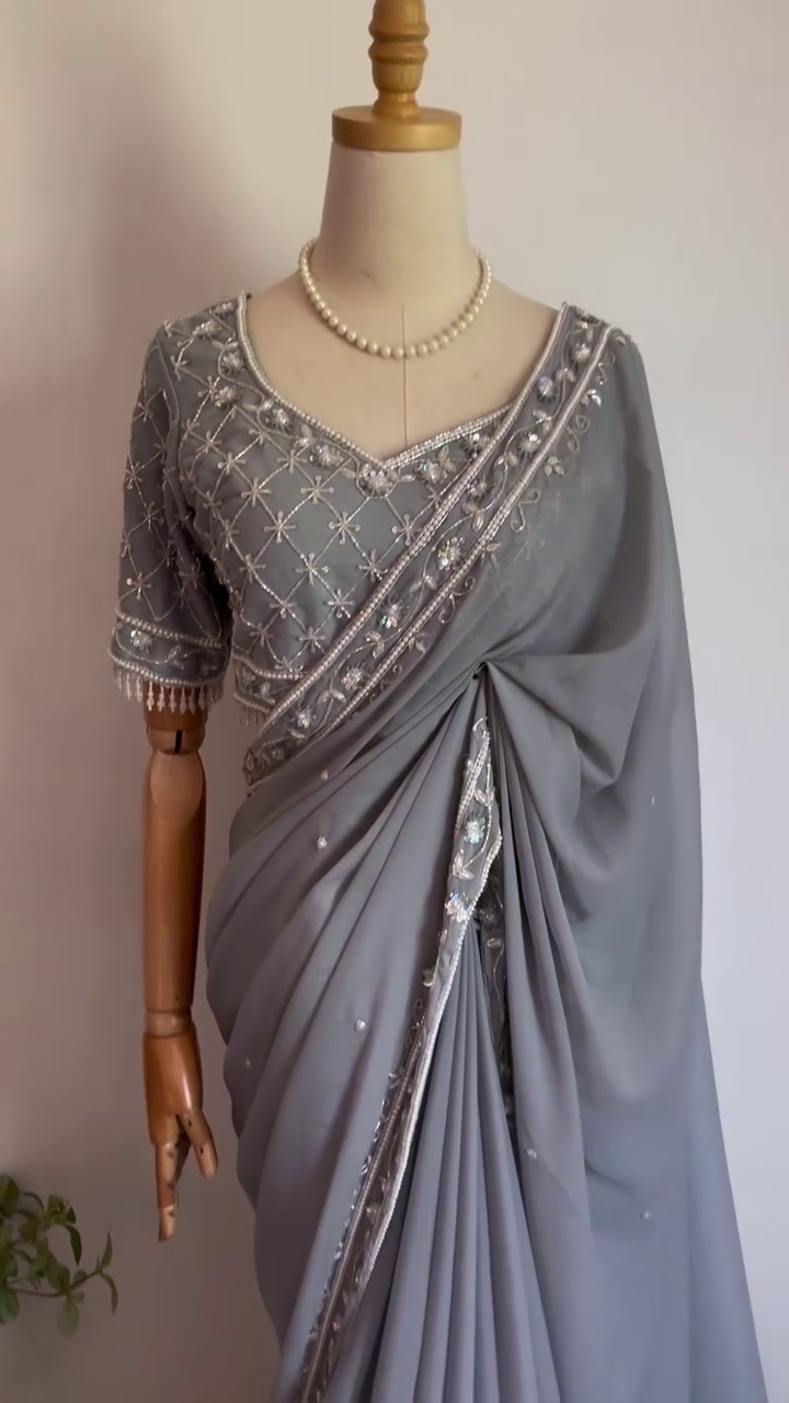 Grey Georgette Saree with Intricate Silver Embroidery, Mirror Work Border, and Matching Heavily Embellished Blouse – Perfect for Festive Occasions, Evening Parties, and Elegant Celebrations