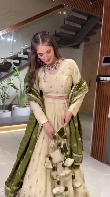 Designer Embroidered Cream Lehenga Choli Set with Heavy Tassel Detailing and Contrasting Velvet Dupatta for Festive and Wedding Wear