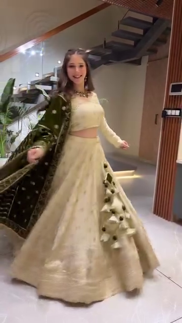 Designer Embroidered Cream Lehenga Choli Set with Heavy Tassel Detailing and Contrasting Velvet Dupatta for Festive and Wedding Wear