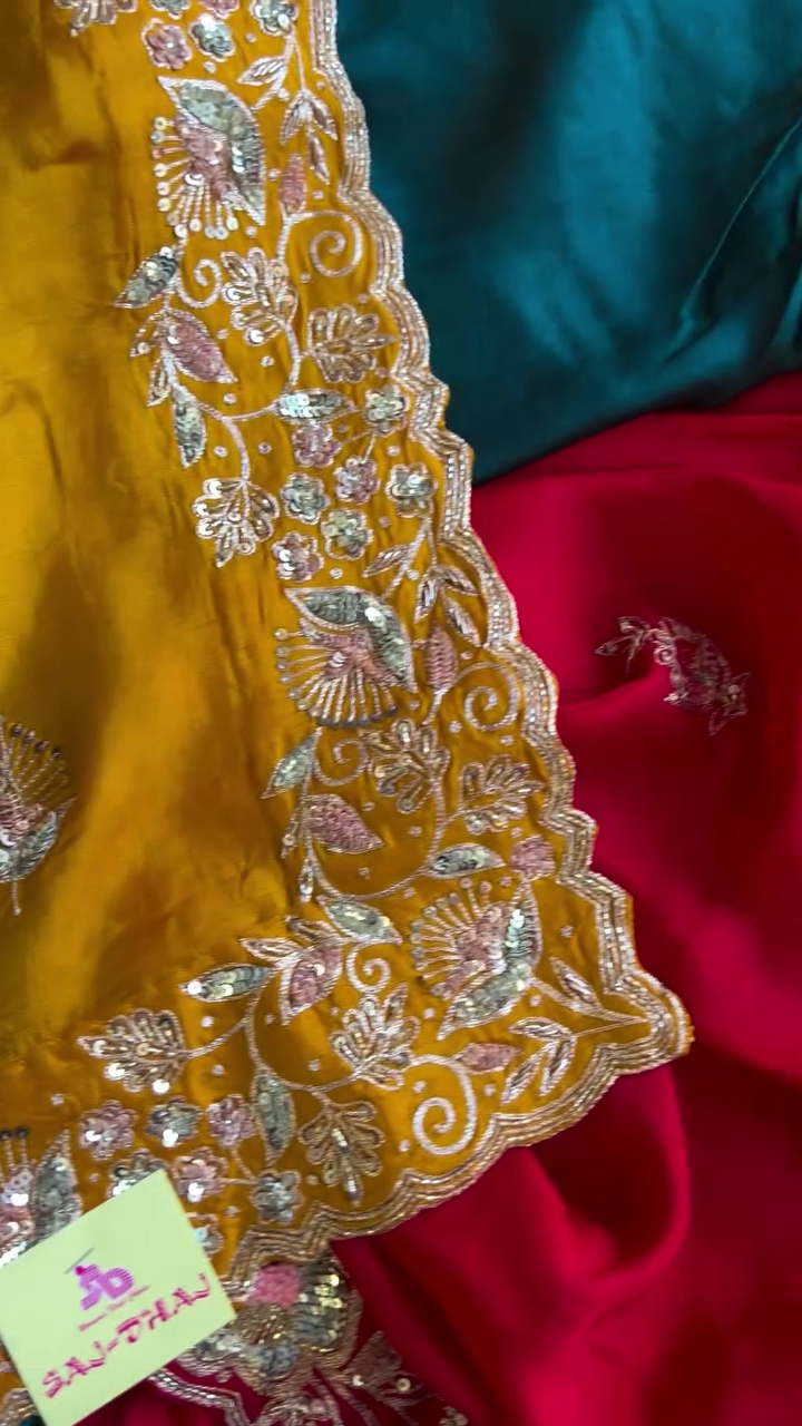 Luxurious Red Silk Saree with Heavy Golden Zari and Sequin Embroidery Border Paired with Contrasting Designer Blouse Pieces in Teal and Mustard Yellow Perfect for Weddings and Festive Occasions