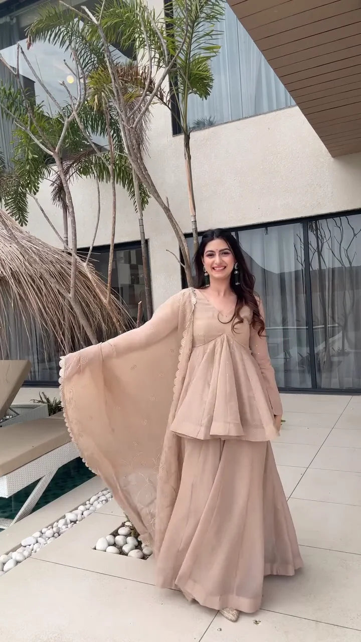 Beige Peplum Style Anarkali Dress with Flared Pants – Featuring Intricate Embroidery and a Sheer Dupatta with Scalloped Edges, Perfect for Weddings