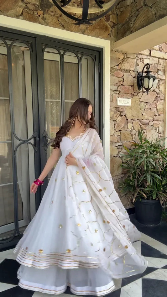 White Anarkali Dress with Intricate Gold Floral Embroidery and Delicate Sequin Work – Featuring a Flowing Skirt, V-neckline, and Matching Dupatta