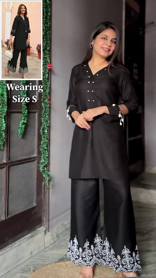 Black Tunic with Button Detailing and Embellished Sleeves, Paired with Matching Black Palazzo Pants featuring Intricate White Embroidery