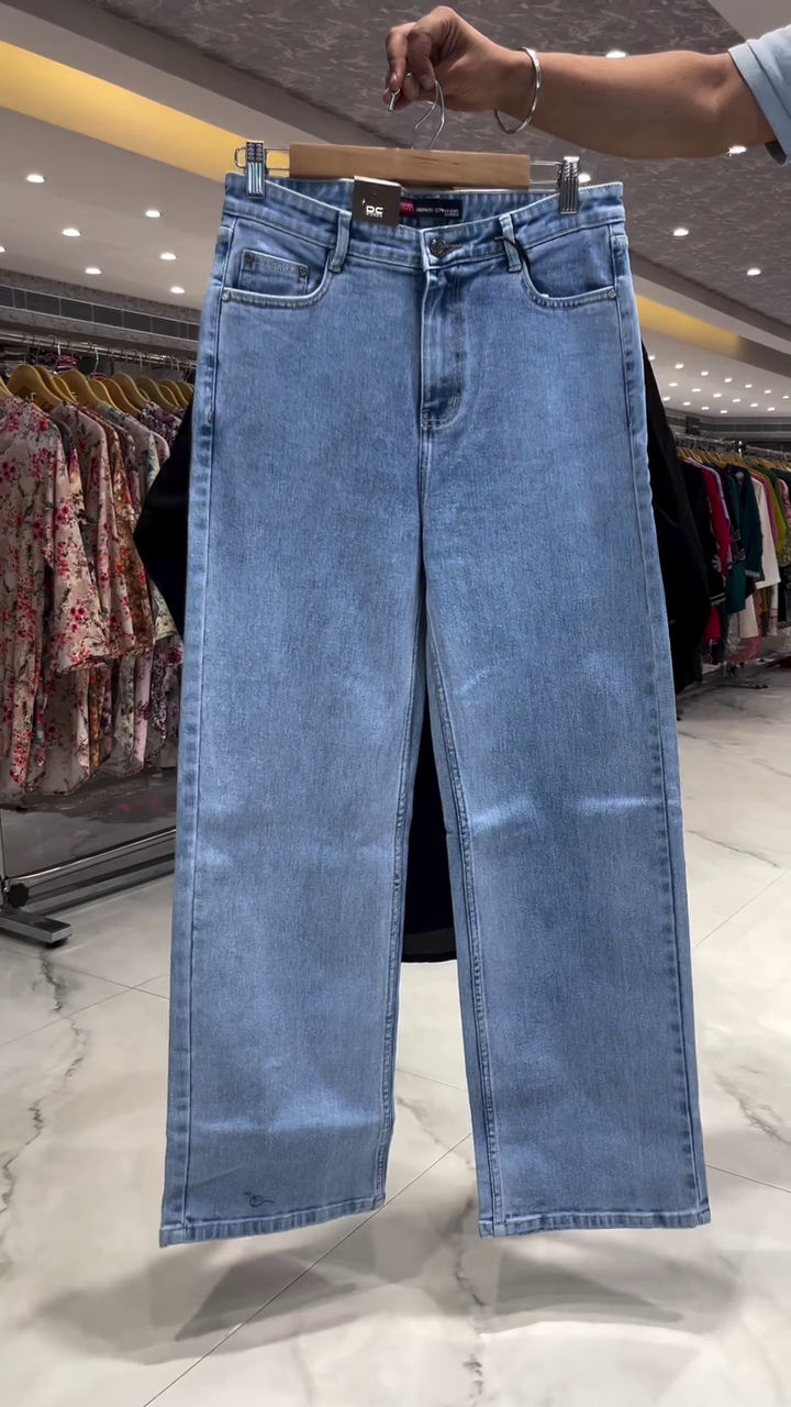 Black Short Kurti with Multicolor Floral Thread Embroidery on Neckline, Sleeves, and Hemline Paired with Light Blue Straight Denim Jeans – A Perfect Blend of Ethnic and Casual for Daily and Semi-Festive Wear